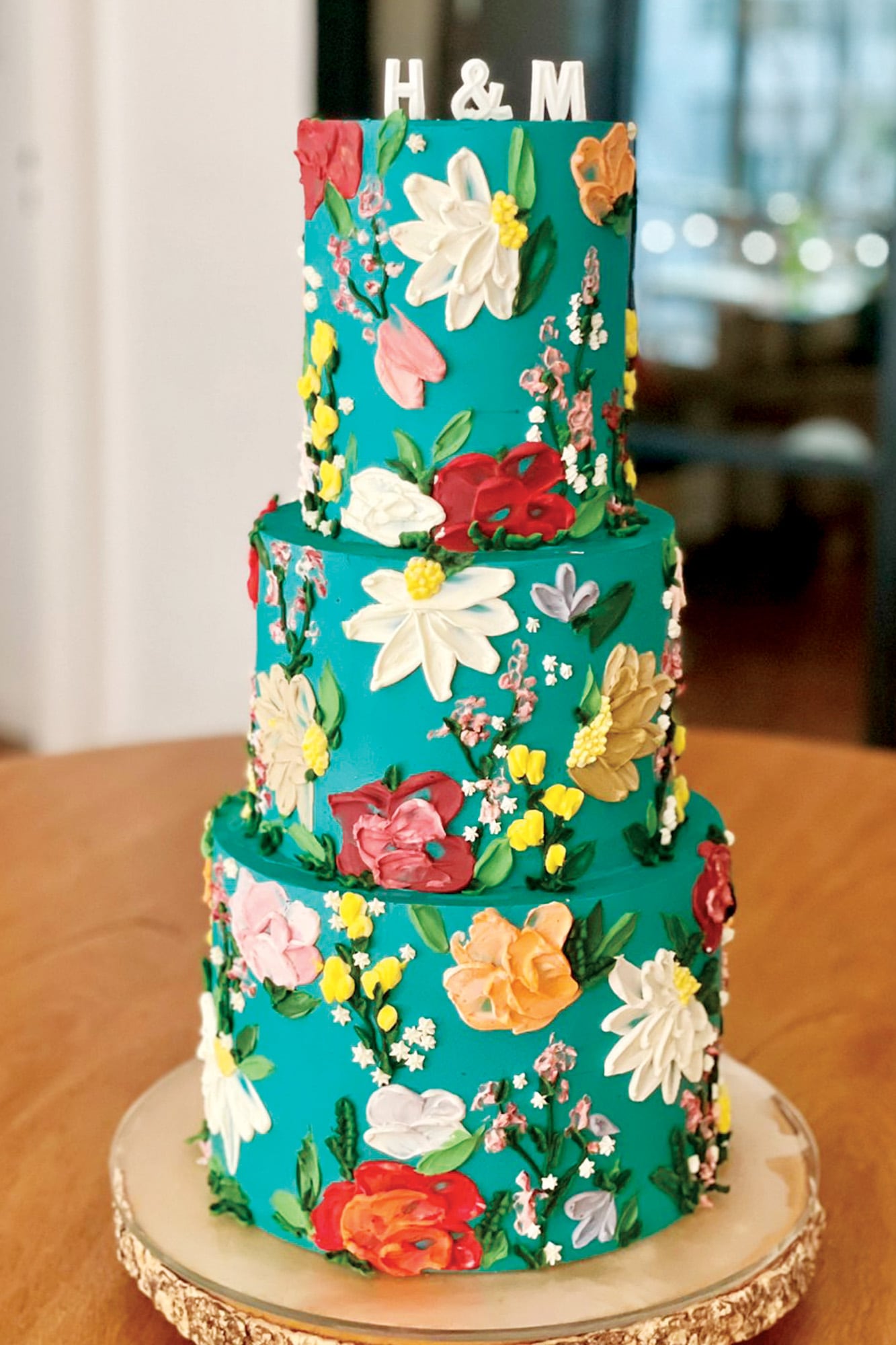 La original torta de bodas, de tres pisos y de vainilla con dulce de leche, fue un diseño de Kekukis, la patisserie de María Paz Tailhade.