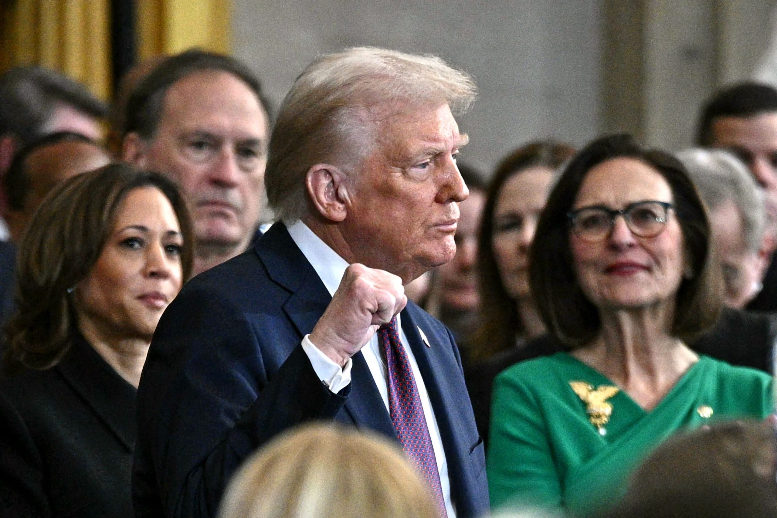 US President Donald Trump pumps his fist before delivering his inaugural address after being sworn in as the the 47th president of the United States in the Rotunda of the US Capitol on January 20, 2025 in Washington, DC. (Photo by Brendan SMIALOWSKI / AFP)