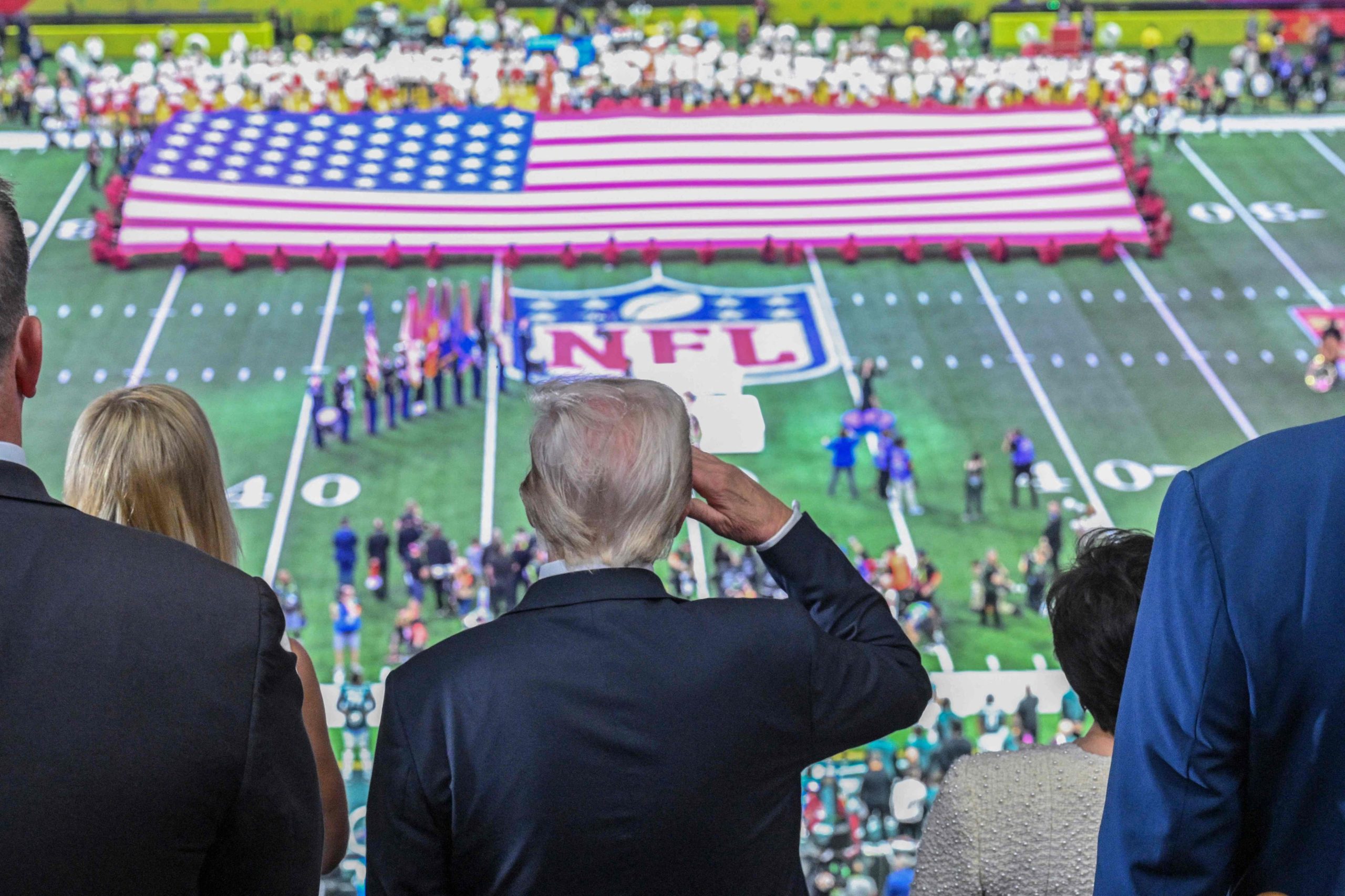 US President Donald Trump salutes as the national anthem is played before the start of Super Bowl LIX between the Kansas City Chiefs and the Philadelphia Eagles at Caesars Superdome in New Orleans, Louisiana, February 9, 2025. (Photo by ROBERTO SCHMIDT / AFP)