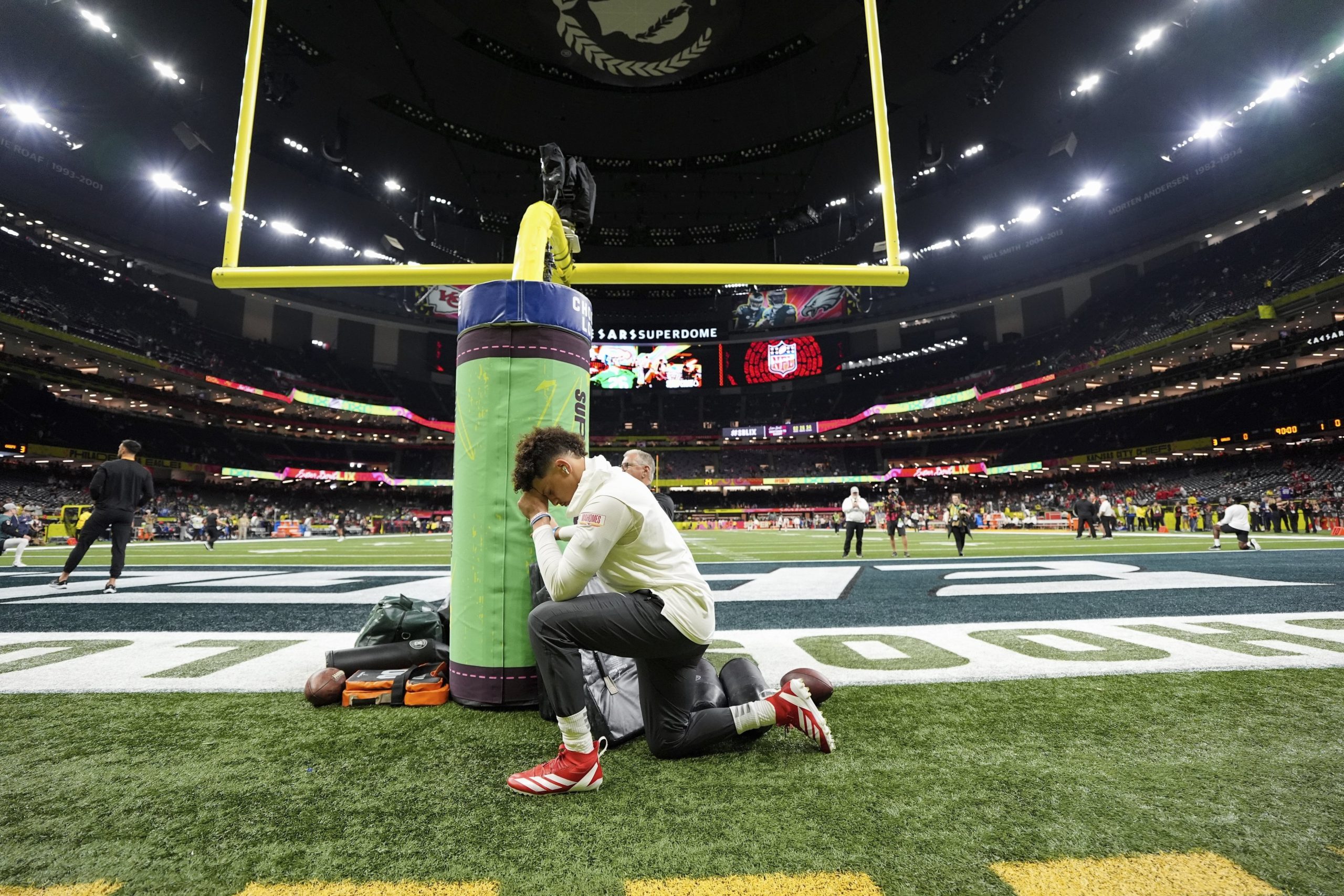 Kansas City Chiefs quarterback Patrick Mahomes kneels on the field before the NFL Super Bowl 59 football game against the Philadelphia Eagles, Sunday, Feb. 9, 2025, in New Orleans. (AP Photo/Abbie Parr)