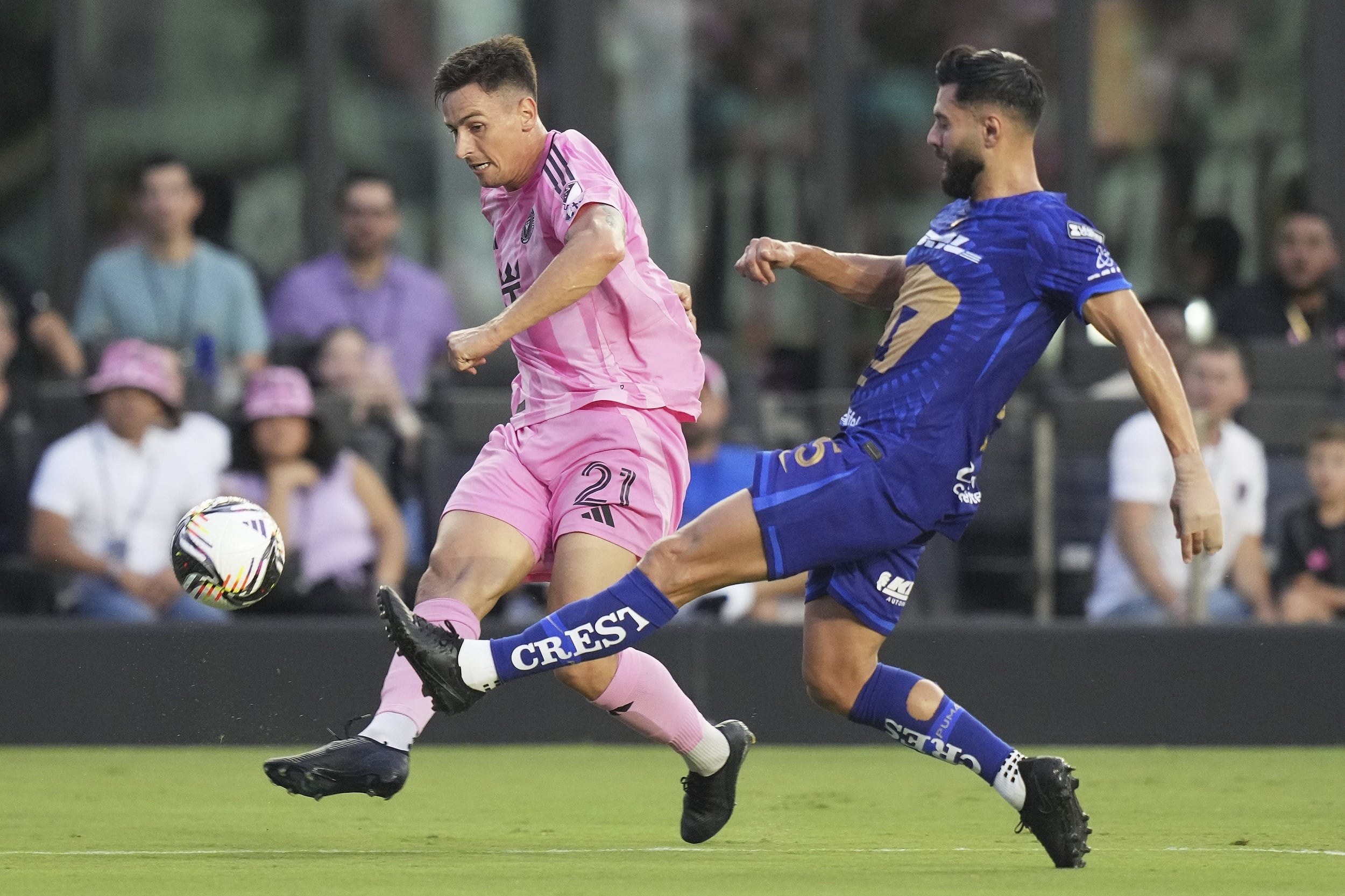 Inter Miami forward Tadeo Allende (21) attempts a shot on the goal as Pumas UNAM defender Ruben Duarte (5) defends during the first half of a Leagues Cup soccer match, Wednesday, Aug. 6, 2025, in Fort Lauderdale, Fla. (AP Photo/Lynne Sladky)