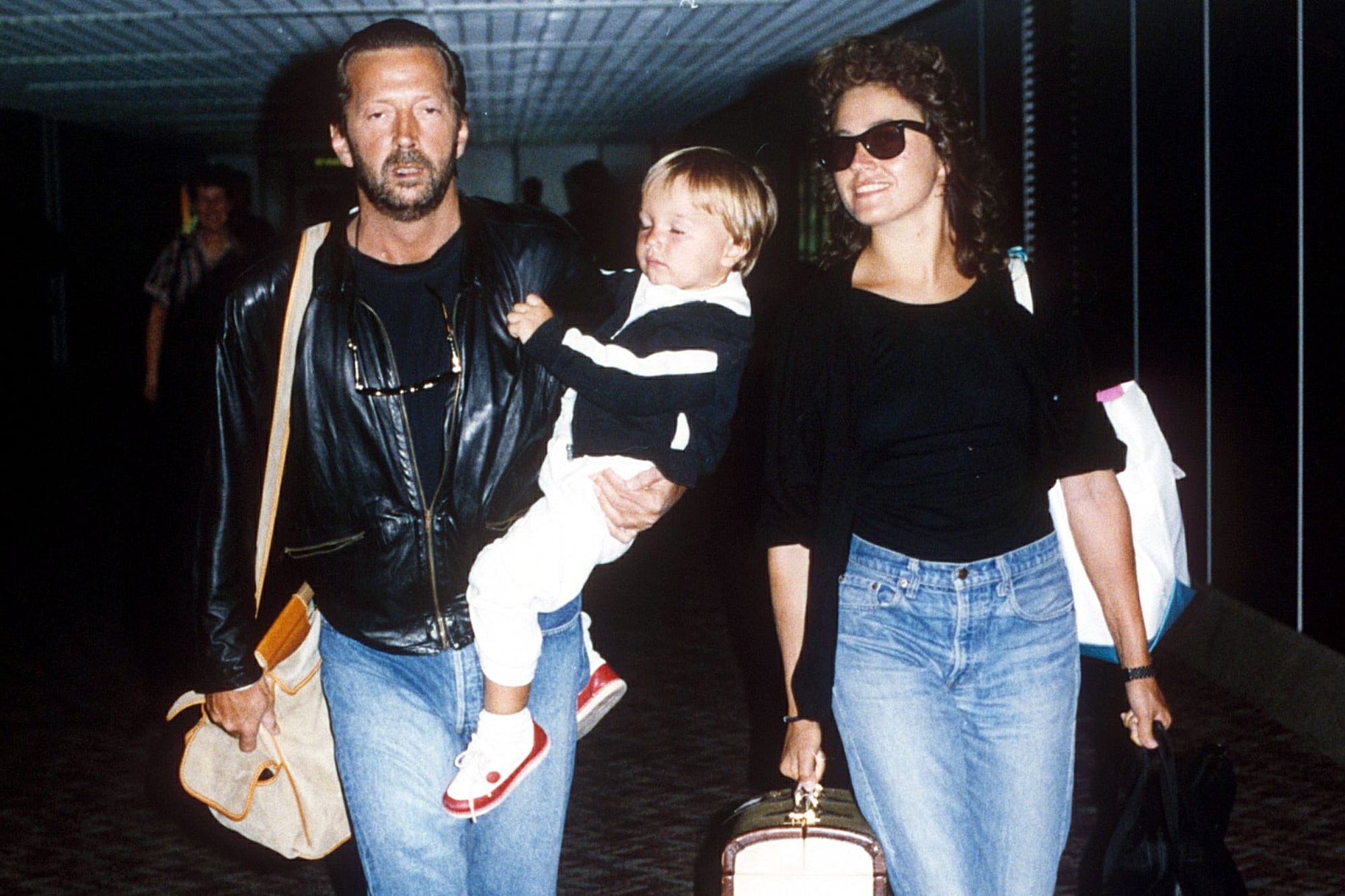 Eric Clapton junto a Lory Del Santo y su hijo Conor