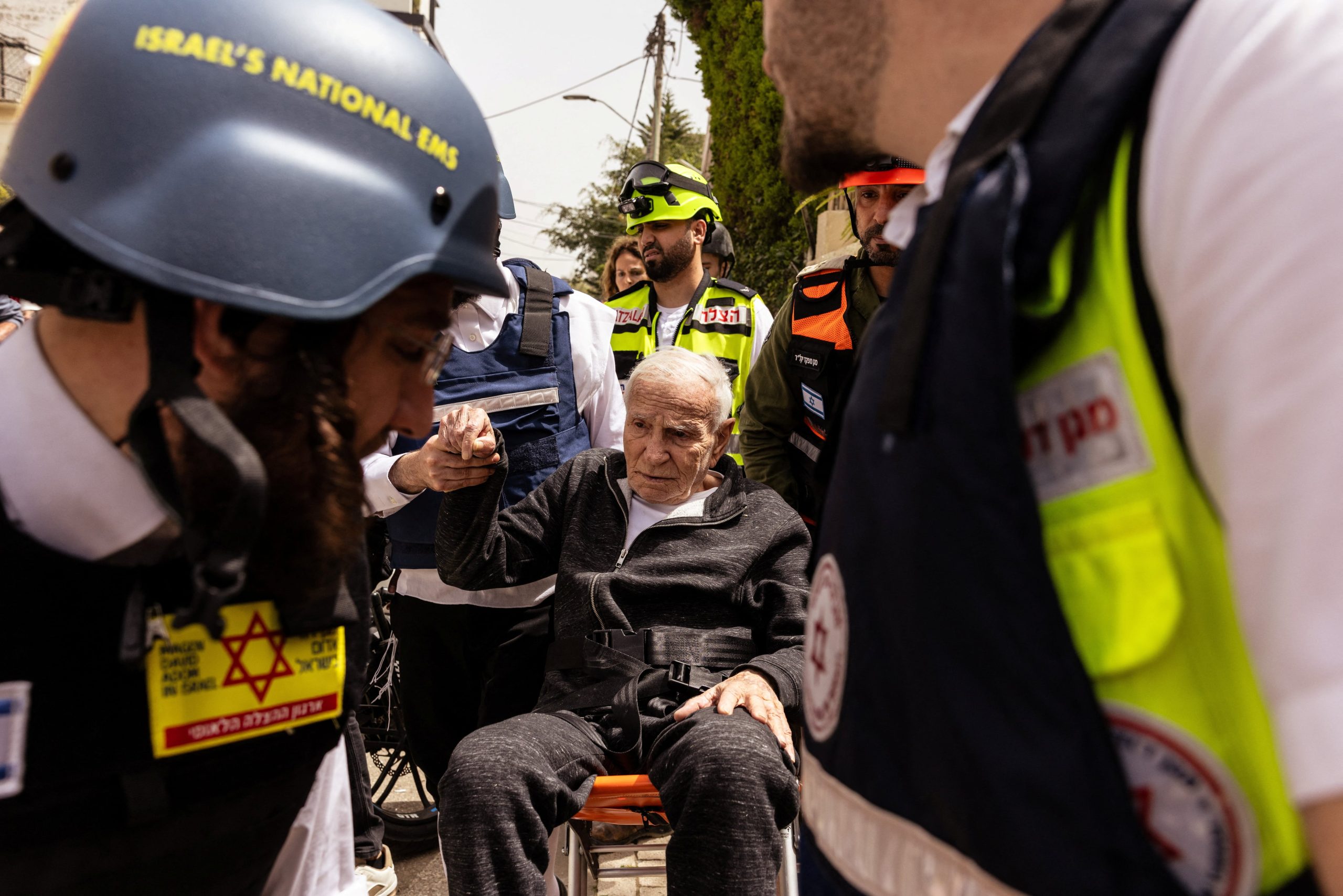 A man receives assistance at an impact site, following a barrage of missiles launched from Iran, amid the U.S.-Israeli conflict with Iran, in Ramat Gan, Israel, April 4, 2026. REUTERS/Nir Elias