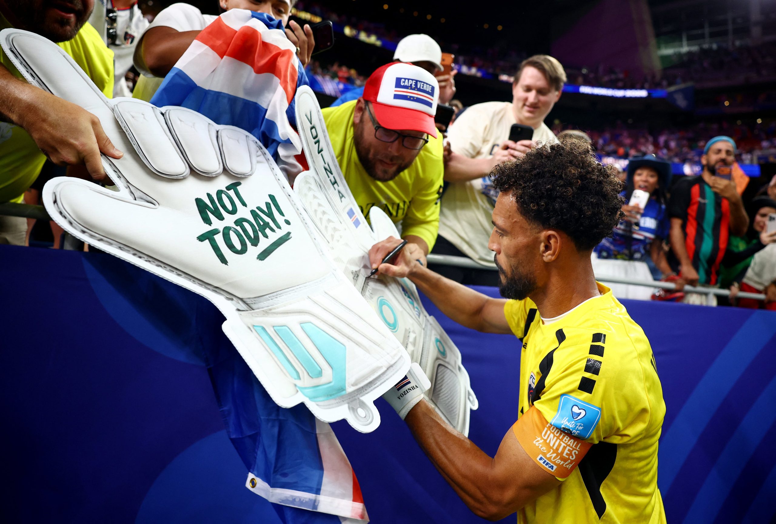 Soccer Football - FIFA World Cup 2026 - Group H - Cape Verde v Saudi Arabia - Houston Stadium, Houston, Texas, U.S. - June 26, 2026 Cape Verde's Vozinha signs autographs after the match as Cape Verde qualify for the knockout stages of the World Cup REUTERS/Phil Noble
