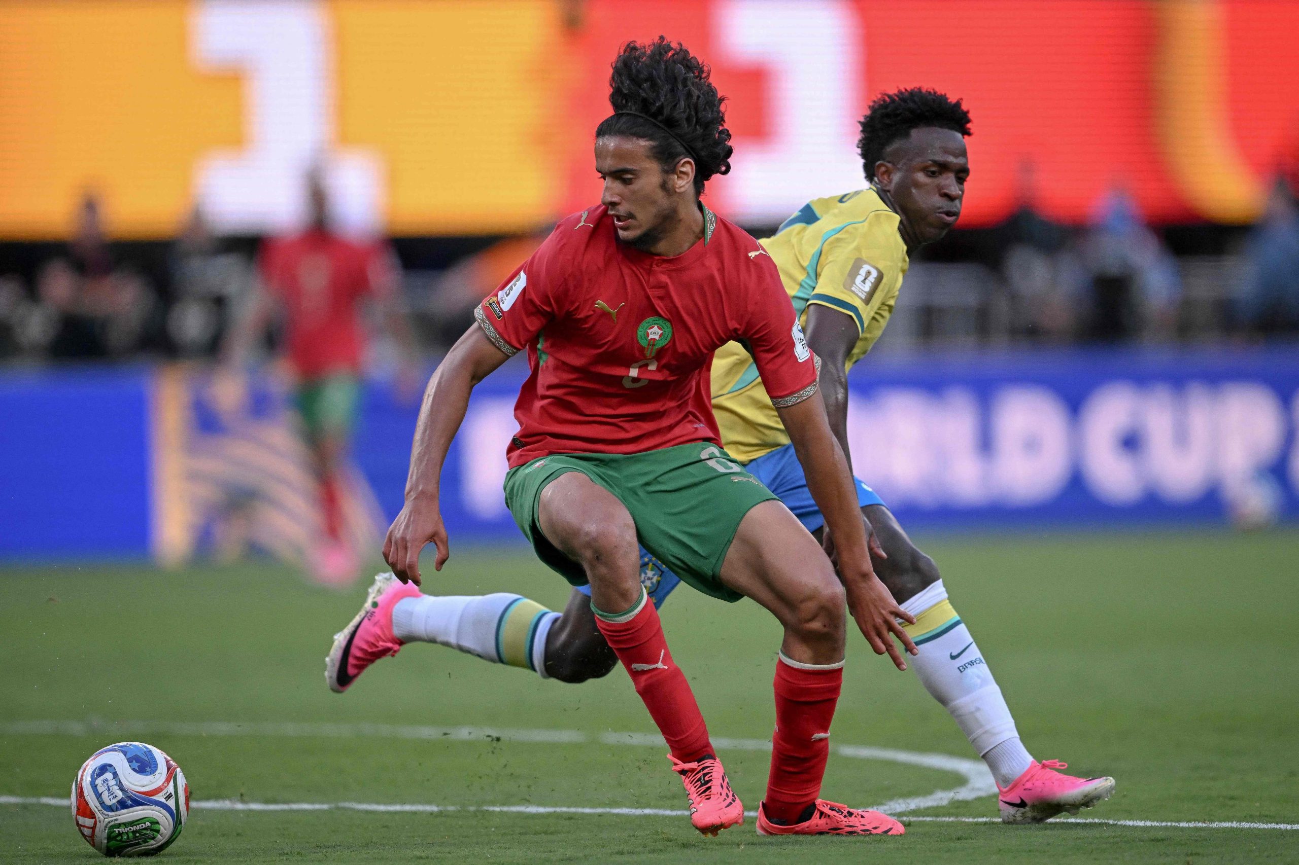Morocco's midfielder #06 Ayyoub Bouaddi and Brazil's forward #07 Vinicius Junior during the 2026 World Cup Group C football match between Brazil and Morocco at the New York/New Jersey Stadium in East Rutherford on June 13, 2026. (Photo by MAURO PIMENTEL / AFP)