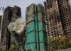 Tratan de rescatar a un centenar de atrapados en los rascacielos del incendio de Hong Kong, que deja ya 128 muertos