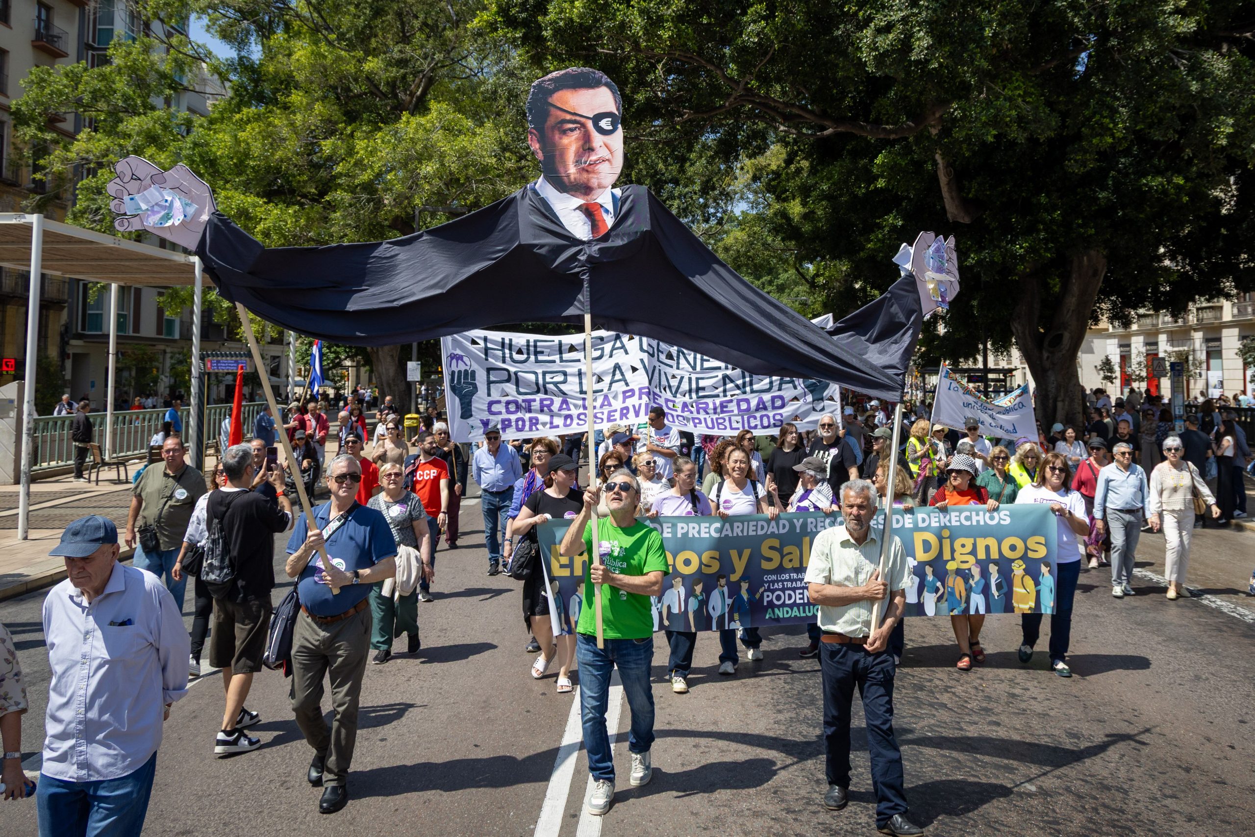 Un cartel contra Juan Manuel Moreno en la manifestación en Málaga.