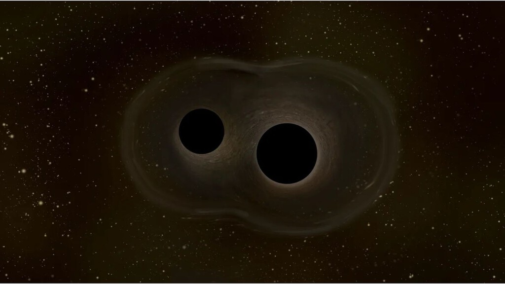 La fusión de agujeros negros que rompió todas las reglas tenía truco: una lente gravitacional pudo haber inflado su tamaño 